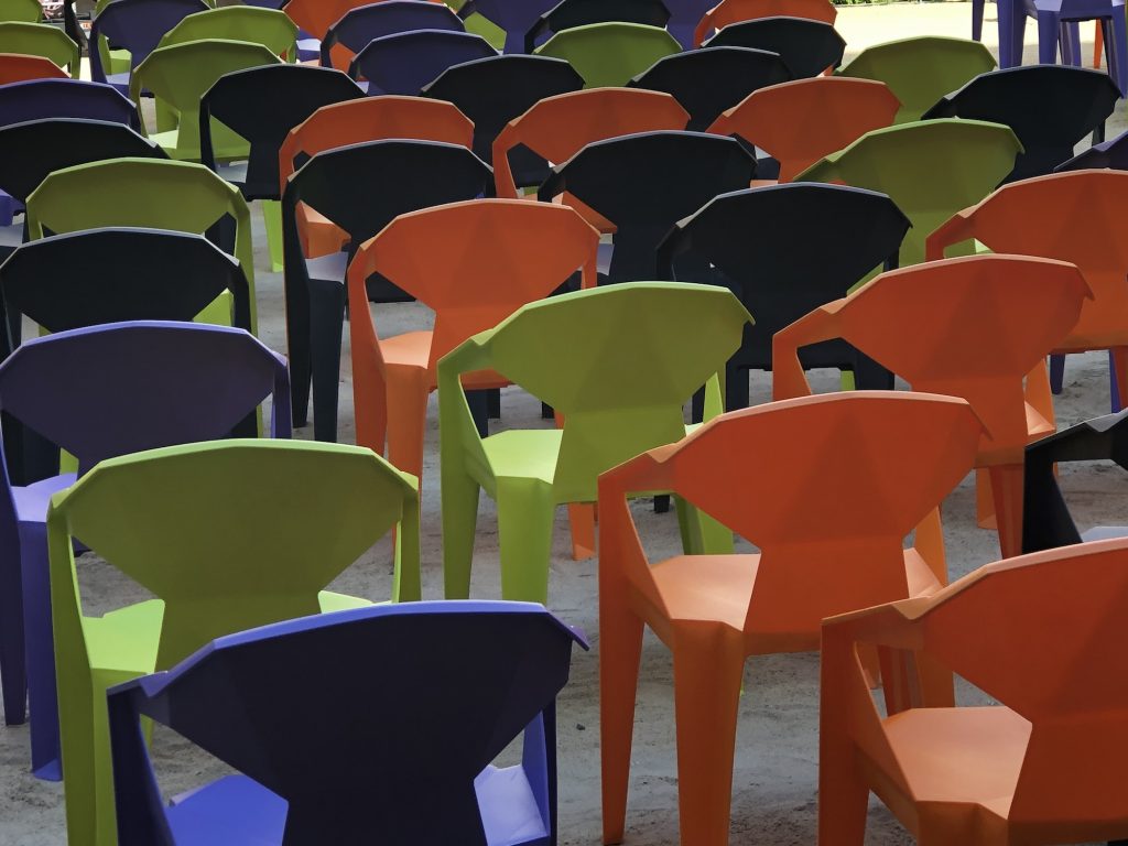 colorful chairs at outdoor concert or conference event